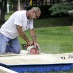 installer cutting pieces for home addition