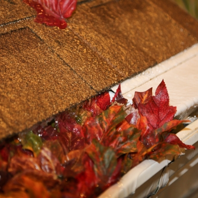 clogged gutter and gutter with leaf guard