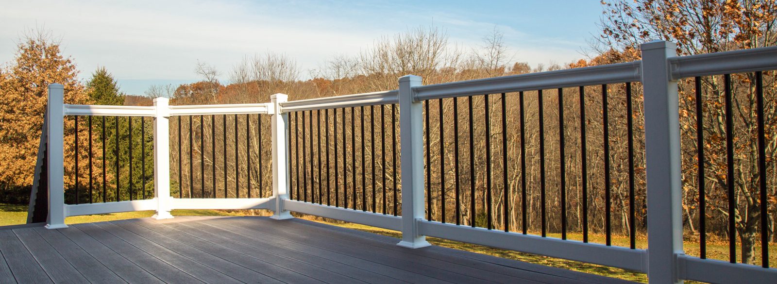 nonemaker - deck with vinyl railings off of 4-season room