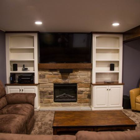 finished basement with fireplace and entertainment center