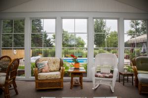Nadeau - view of pool and backyard from inside completed three-season room