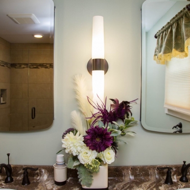 detail of dual mirrors of remodeled bathroom vanity