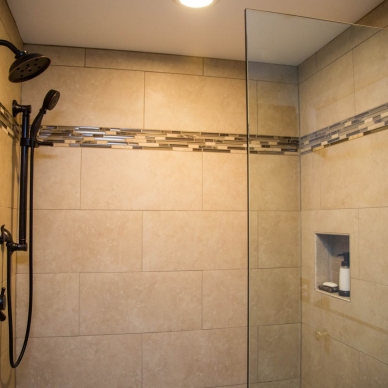 closeup of walk-in shower unit with custom tile