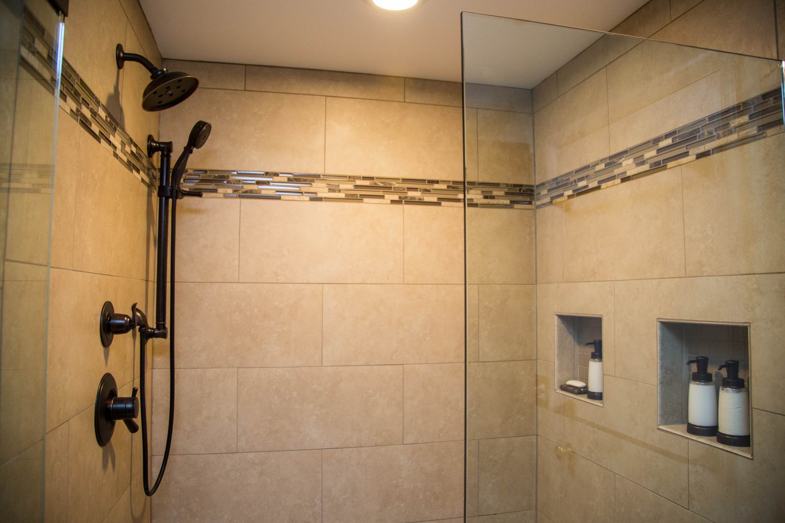 closeup of walk-in shower unit with custom tile