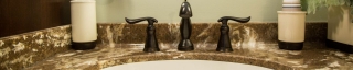 detail of sink and faucet in a newly remodeled bathroom