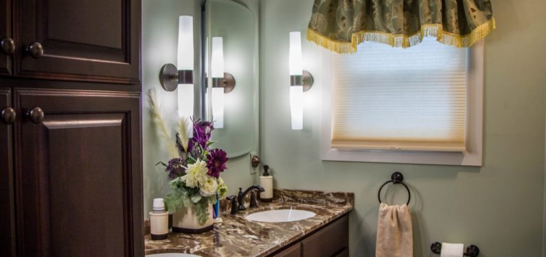 remodeled bathroom with dual vanity sinks