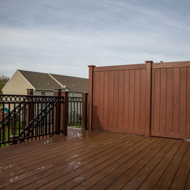 new vinyl railings and privacy fence on deck and stairs