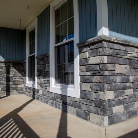 addition of stone wall to lower portion of front porch siding