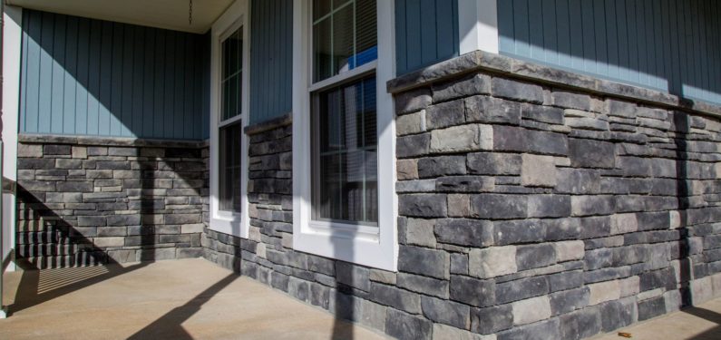 addition of stone wall to lower portion of front porch siding