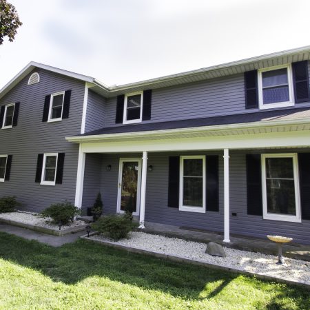 front of house with new vinyl siding