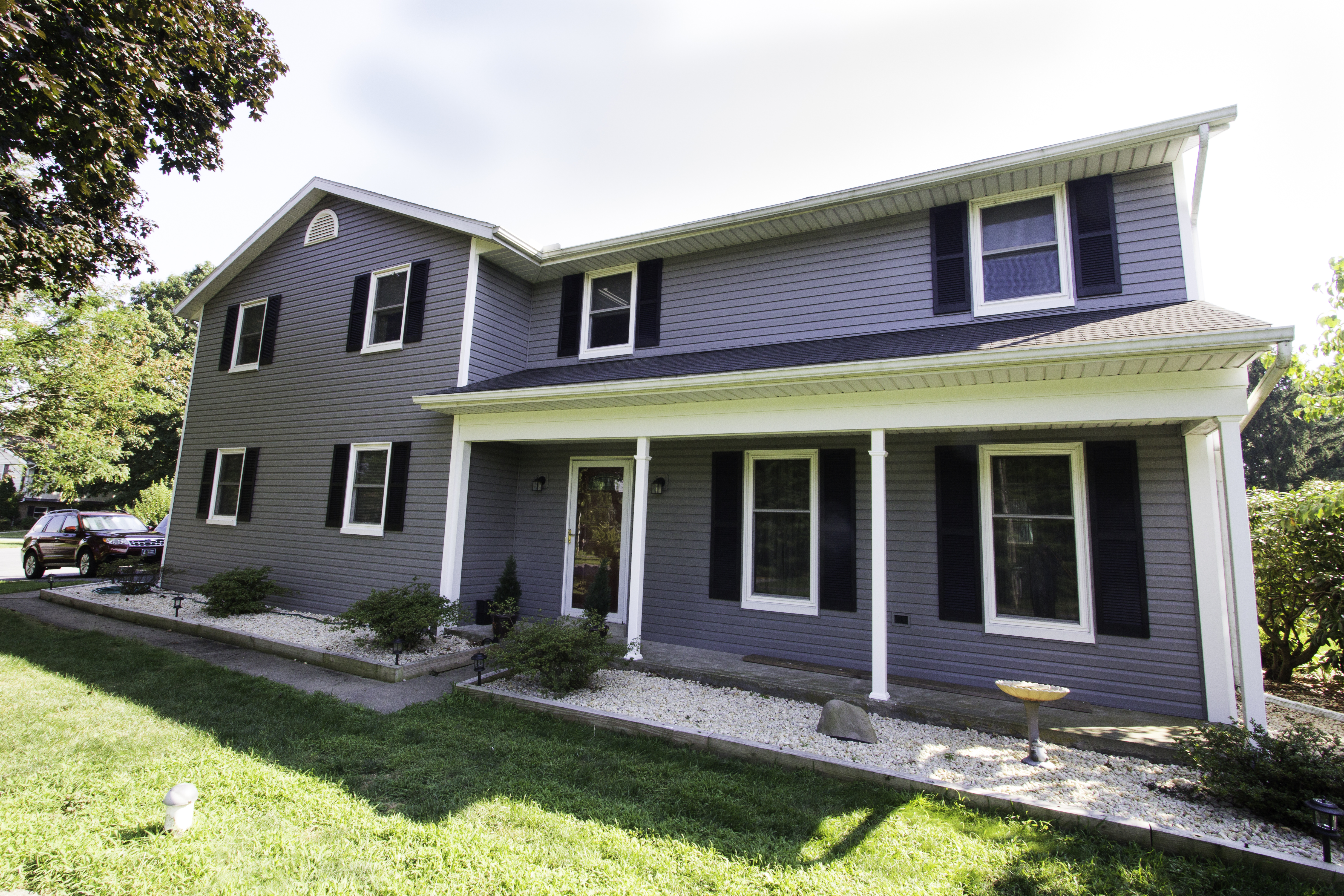 Morin - front of house with new vinyl siding