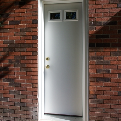 white replacement door with two small upper windows