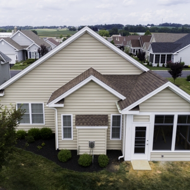 aerial view of house with new deck and sunroom