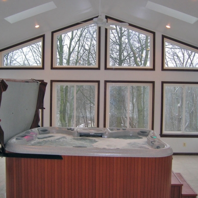 interior of sunroom with a hot tub