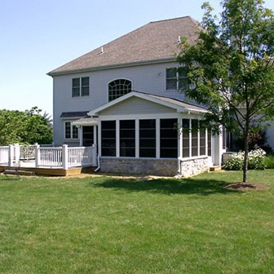 finished sunroom addition with deck