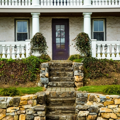 white house with purple entry door