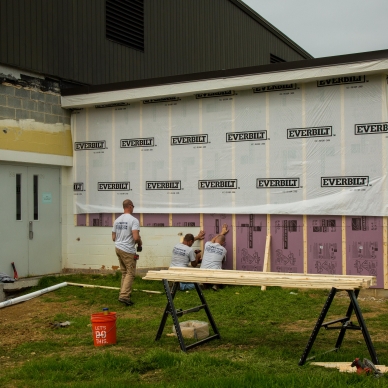 removing old concrete bricks and adding homewrap