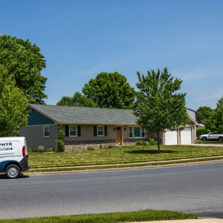 zephyr thomas van in front of house with new roof