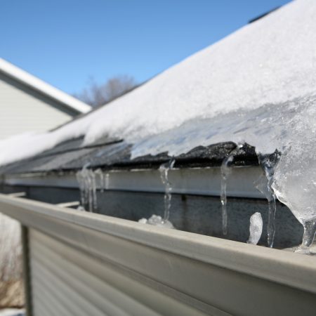 prevent winter roof & gutter damage - ice and snow on roof and gutter