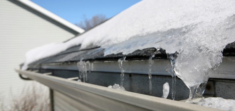 prevent winter roof & gutter damage - ice and snow on roof and gutter