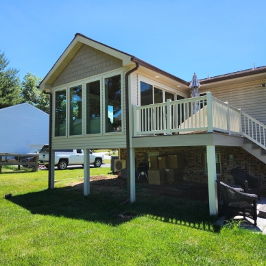 Mast - exterior view of completed addition and deck from the yard