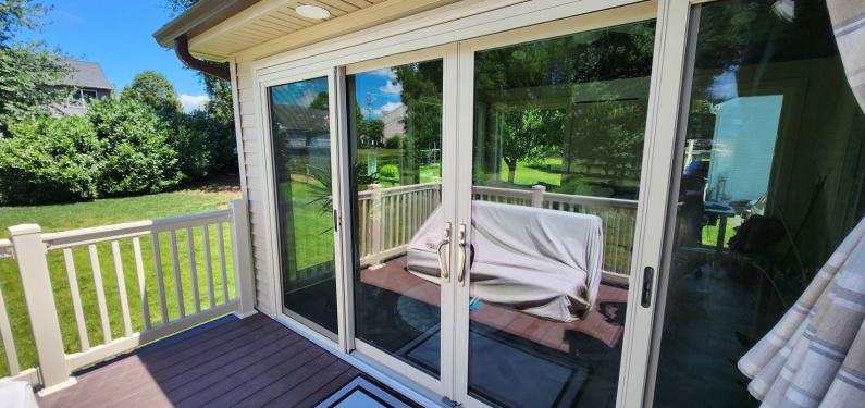 Mast - view of closed sliding patio doors on addition from the deck