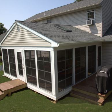 August - angled view of exterior of three-season room addition