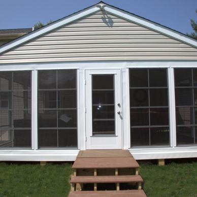 August - front view of completed three-season room with small landing and stairs