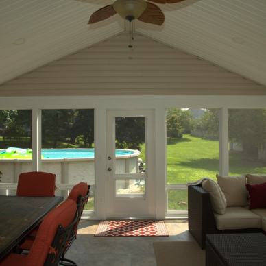 August - interior view of door and windows in a three-season room addition