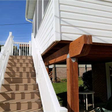 McFarland - exterior view of stairs leading up to finished three-season room addition