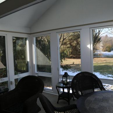 Thomas - view of backyard through windows of three-season room