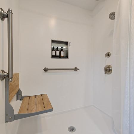 Menard - low-curb shower with built-in seat, bathroom grab bars, and built-in storage niche