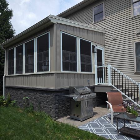 Ressler three-season addition - exterior view of addition and stairs with railing