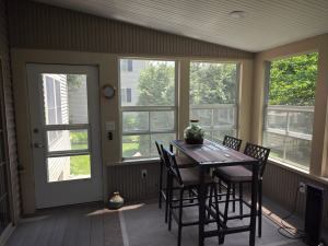 Ressler three-season addition - interior view of door and windows and dining table