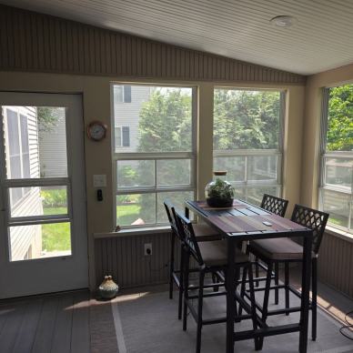 Ressler three-season addition - interior view of door and windows and dining table