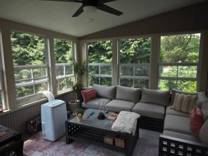 Ressler three-season addition - interior with view of couch and windows